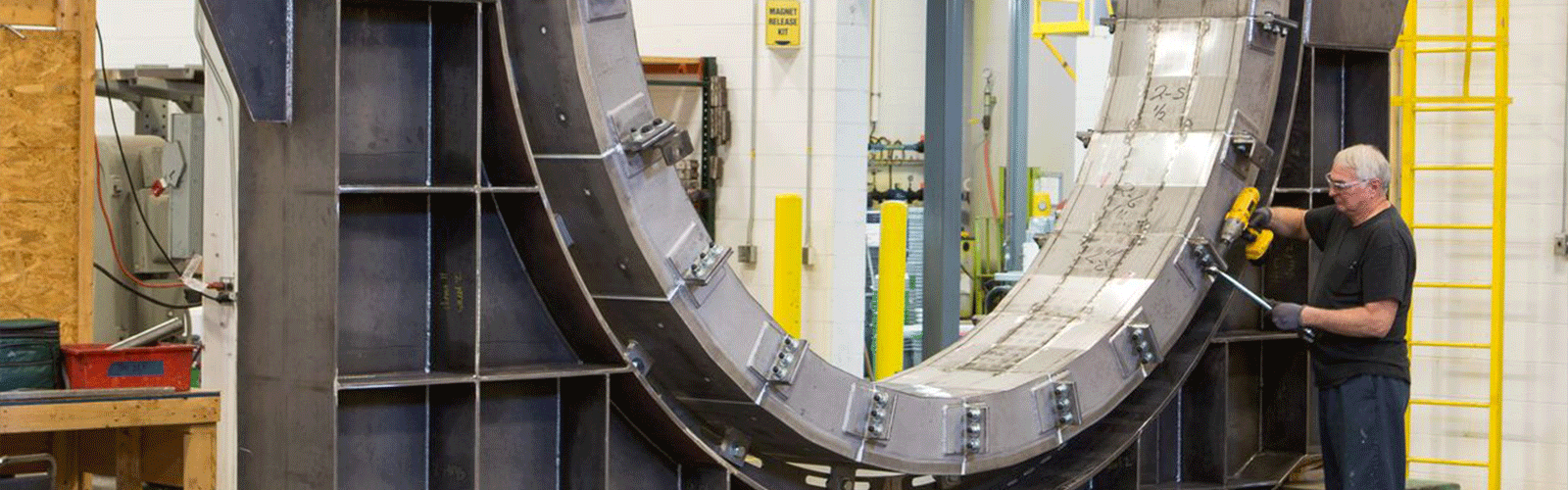 Worker repairing a trunnion magnet