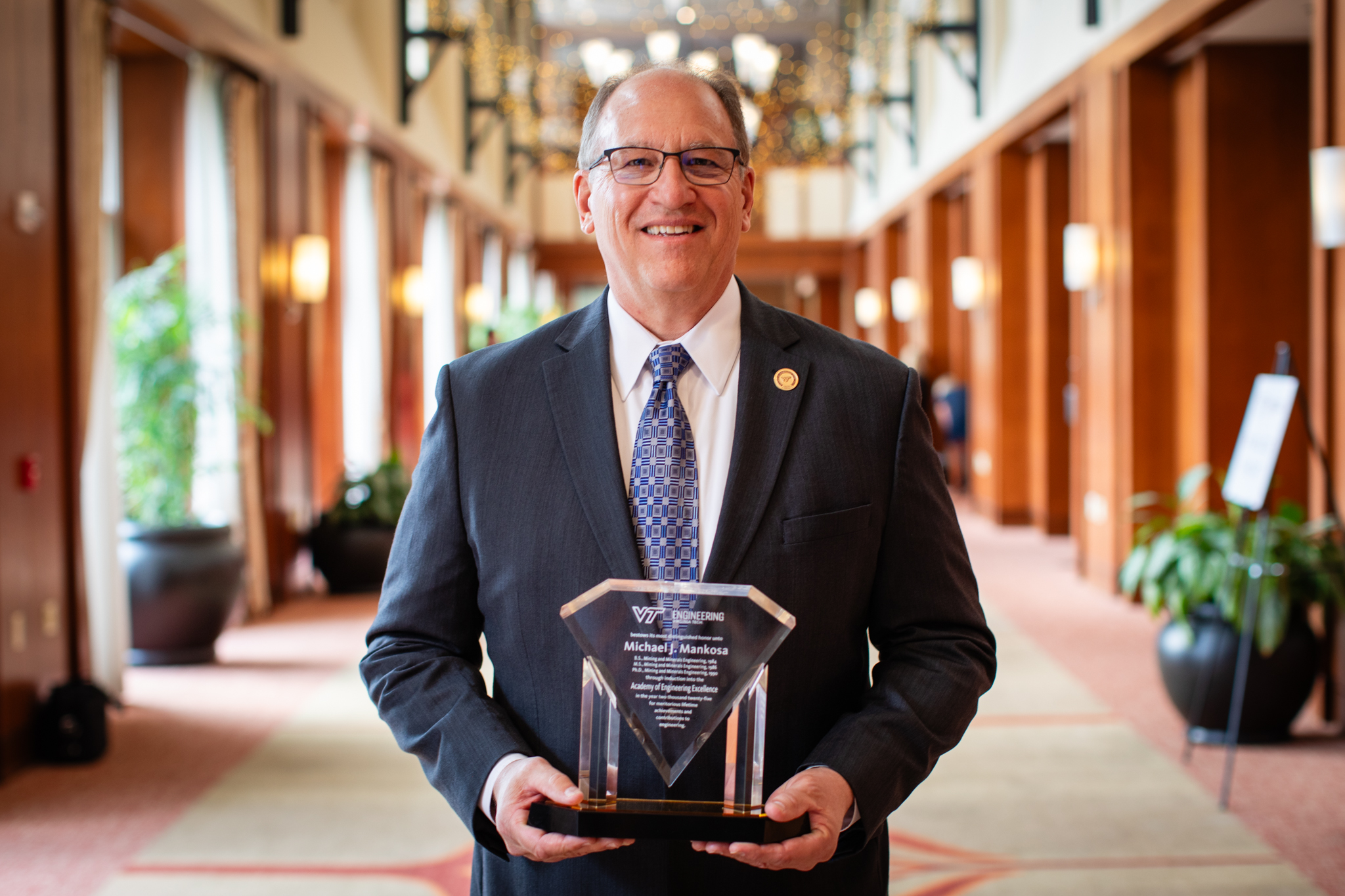 Mankosa, Ph.D. holding Engineering Excellence award